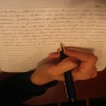 my hand writing in a notebook