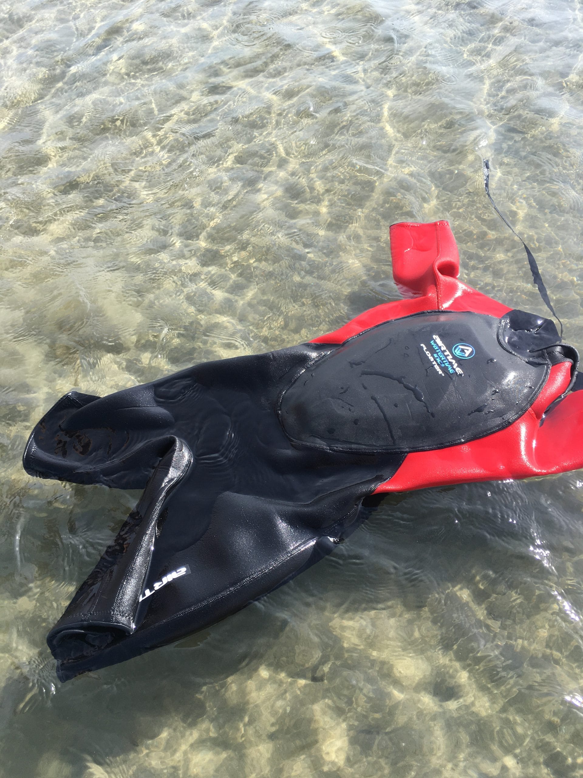 Airtime Waterline wet suit with flotation device in the chest (black with red sleeves)