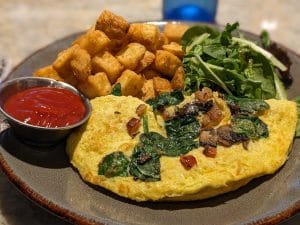 Omelette with oven roasted potatoes and spinach, New Orleans