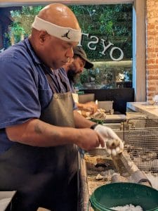 Lorenzo shucking oysters at Peche Seafood Grill New Orleans
