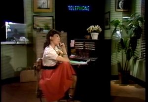 picture of Lily Tomlin playing Ernestine at the operator switchboard